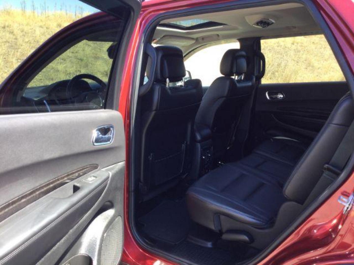 2014 Dp Cherry Red Crystal PC /Black Dodge Durango Limited AWD (1C4RDJDG8EC) with an 3.6L V6 DOHC 24V engine, 8-Speed Automatic transmission, located at 1801 Main Street, Lewiston, 83501, (208) 743-9371, 46.417065, -117.004799 - Photo#7