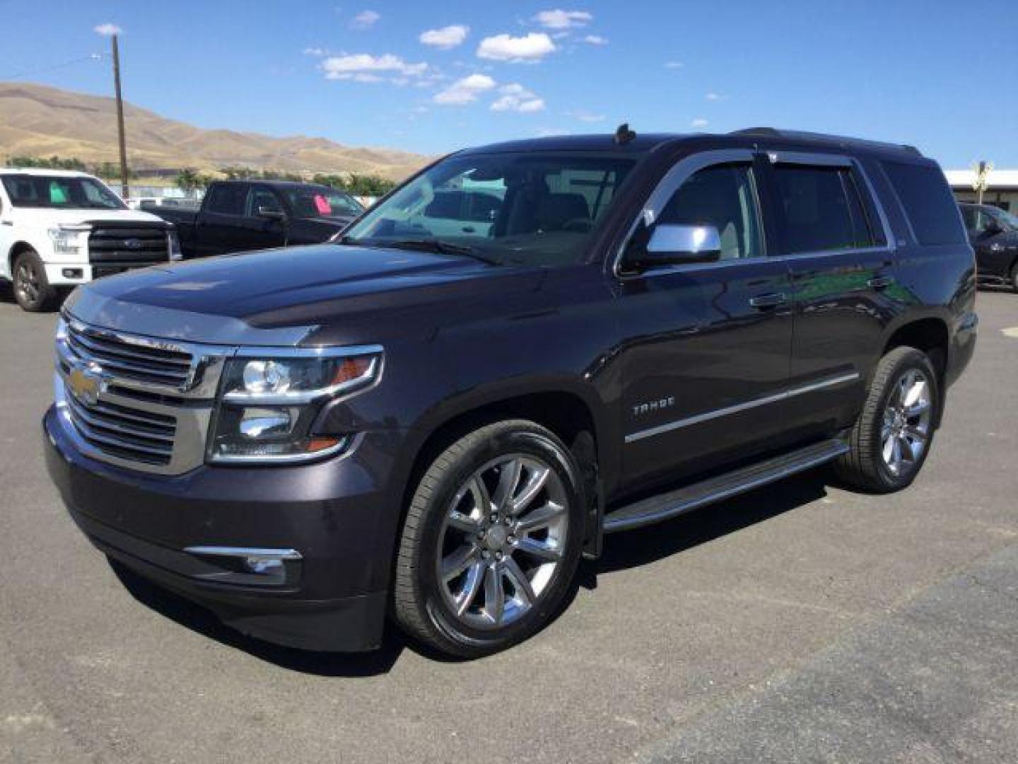 2015 GRAY /Medium Brown Leather Chevrolet Tahoe LTZ 4WD (1GNSKCKC8FR) with an 5.3L V8 OHV 16V engine, 6-Speed Automatic transmission, located at 1801 Main Street, Lewiston, 83501, (208) 743-9371, 46.417065, -117.004799 - Photo#0