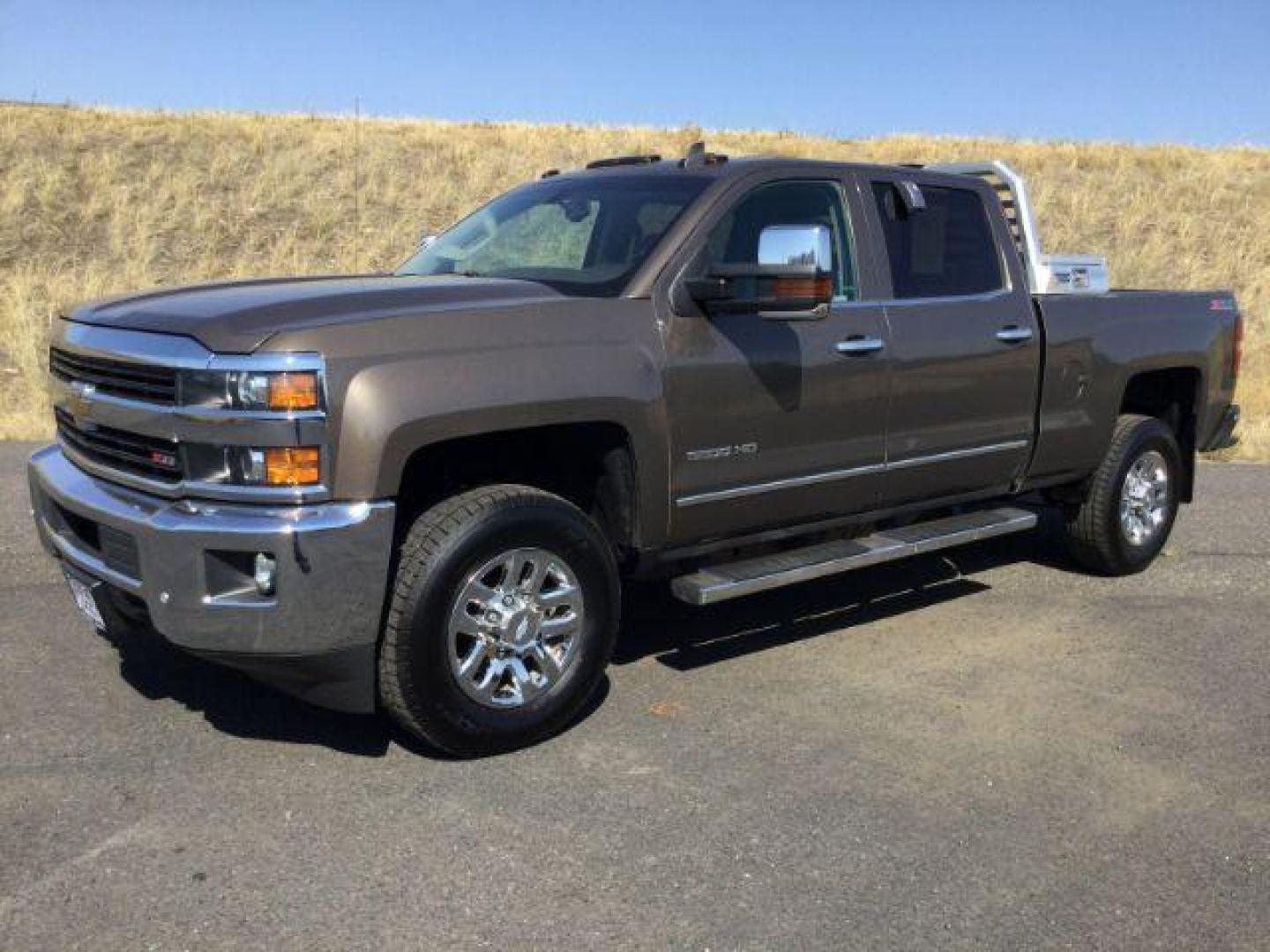 2015 Brownstone Metallic /Cocoa/Dune Chevrolet Silverado 3500HD LTZ Crew Cab 4WD (1GC1K0EG6FF) with an 6.0L V8 OHV 16V FFV engine, 6-Speed Automatic transmission, located at 1801 Main Street, Lewiston, 83501, (208) 743-9371, 46.417065, -117.004799 - Photo#0