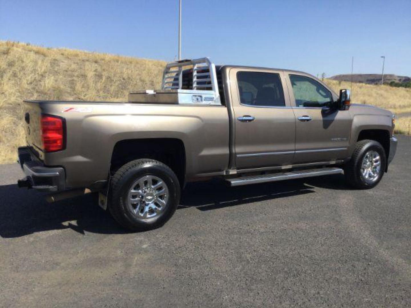 2015 Brownstone Metallic /Cocoa/Dune Chevrolet Silverado 3500HD LTZ Crew Cab 4WD (1GC1K0EG6FF) with an 6.0L V8 OHV 16V FFV engine, 6-Speed Automatic transmission, located at 1801 Main Street, Lewiston, 83501, (208) 743-9371, 46.417065, -117.004799 - Photo#9