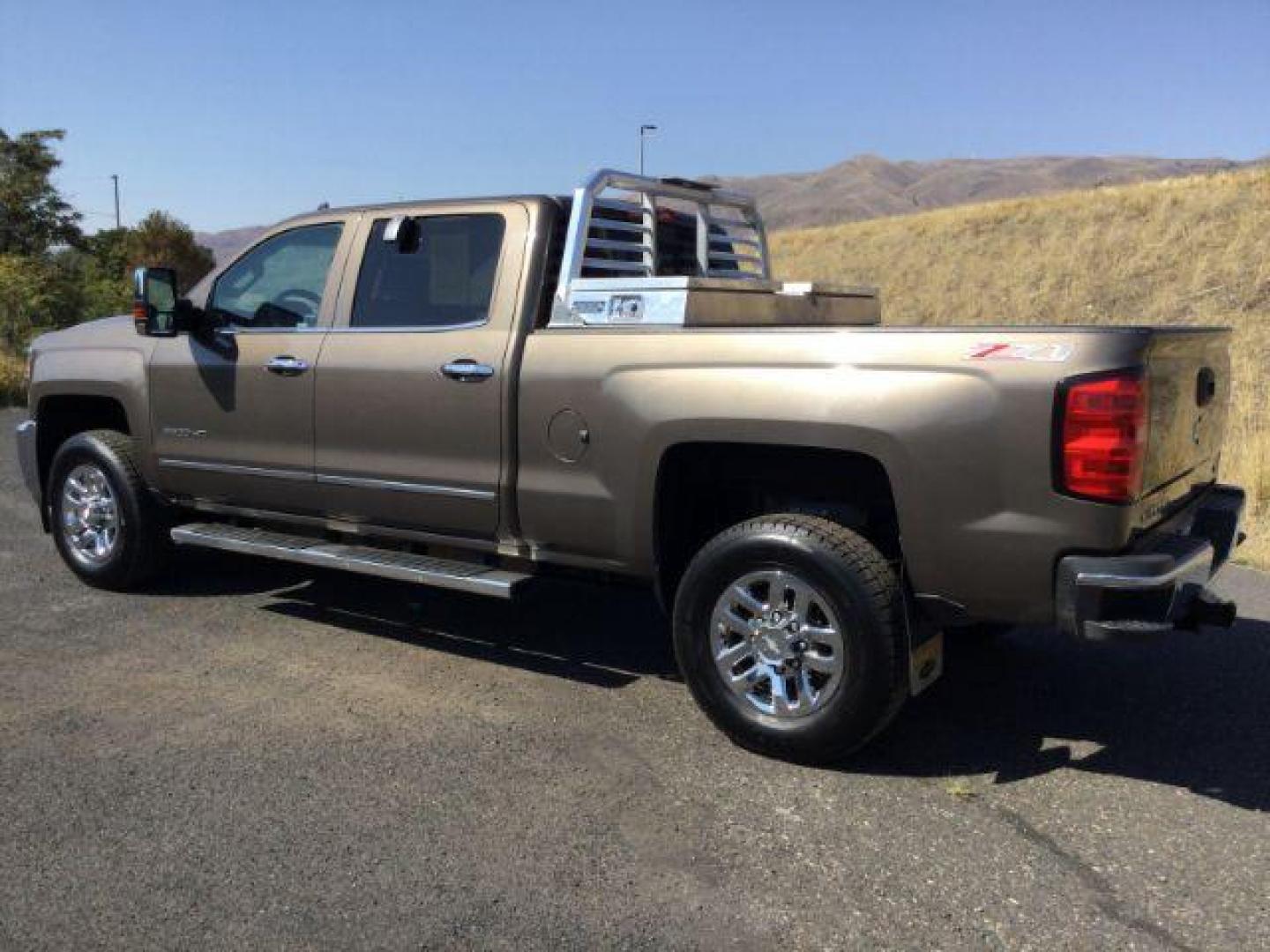 2015 Brownstone Metallic /Cocoa/Dune Chevrolet Silverado 3500HD LTZ Crew Cab 4WD (1GC1K0EG6FF) with an 6.0L V8 OHV 16V FFV engine, 6-Speed Automatic transmission, located at 1801 Main Street, Lewiston, 83501, (208) 743-9371, 46.417065, -117.004799 - Photo#2