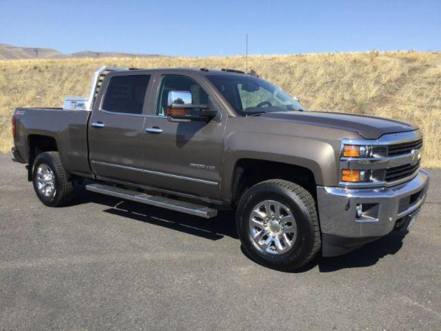 2015 Brownstone Metallic /Cocoa/Dune Chevrolet Silverado 3500HD LTZ Crew Cab 4WD (1GC1K0EG6FF) with an 6.0L V8 OHV 16V FFV engine, 6-Speed Automatic transmission, located at 1801 Main Street, Lewiston, 83501, (208) 743-9371, 46.417065, -117.004799 - Photo#7