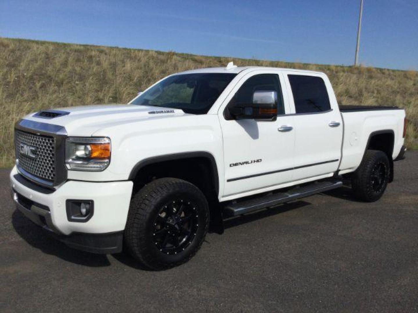 2017 Summit White /Jet Black, leather GMC Sierra 3500HD Denali Crew Cab 4WD (1GT42YEY6HF) with an 6.6L V8 OHV 16 DIESEL engine, 6-Speed Automatic transmission, located at 1801 Main Street, Lewiston, 83501, (208) 743-9371, 46.417065, -117.004799 - Photo#0