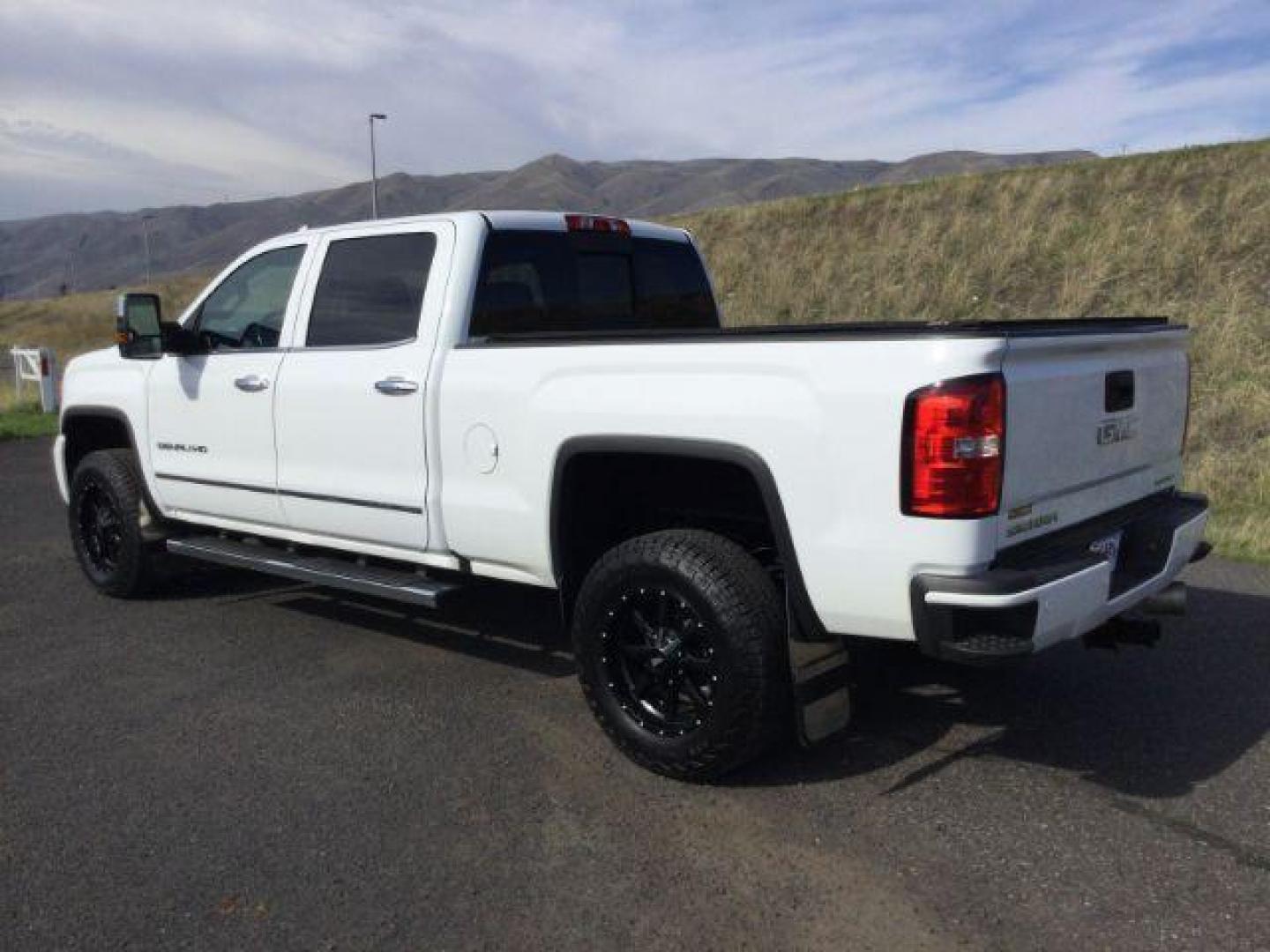 2017 Summit White /Jet Black, leather GMC Sierra 3500HD Denali Crew Cab 4WD (1GT42YEY6HF) with an 6.6L V8 OHV 16 DIESEL engine, 6-Speed Automatic transmission, located at 1801 Main Street, Lewiston, 83501, (208) 743-9371, 46.417065, -117.004799 - Photo#2