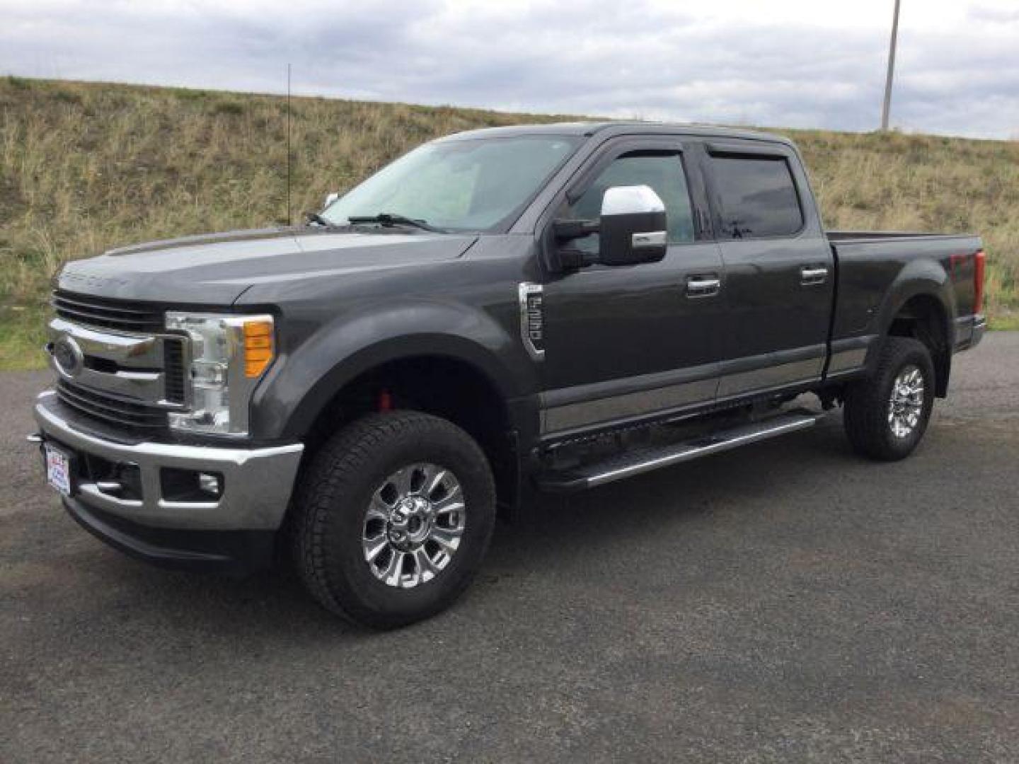 2017 Magnetic Metallic /GRAY CLOTH Ford F-250 SD XLT Crew Cab 4WD (1FT7W2B68HE) with an 6.2L V8 OHV 16V engine, 6-Speed Automatic transmission, located at 1801 Main Street, Lewiston, 83501, (208) 743-9371, 46.417065, -117.004799 - Photo#0