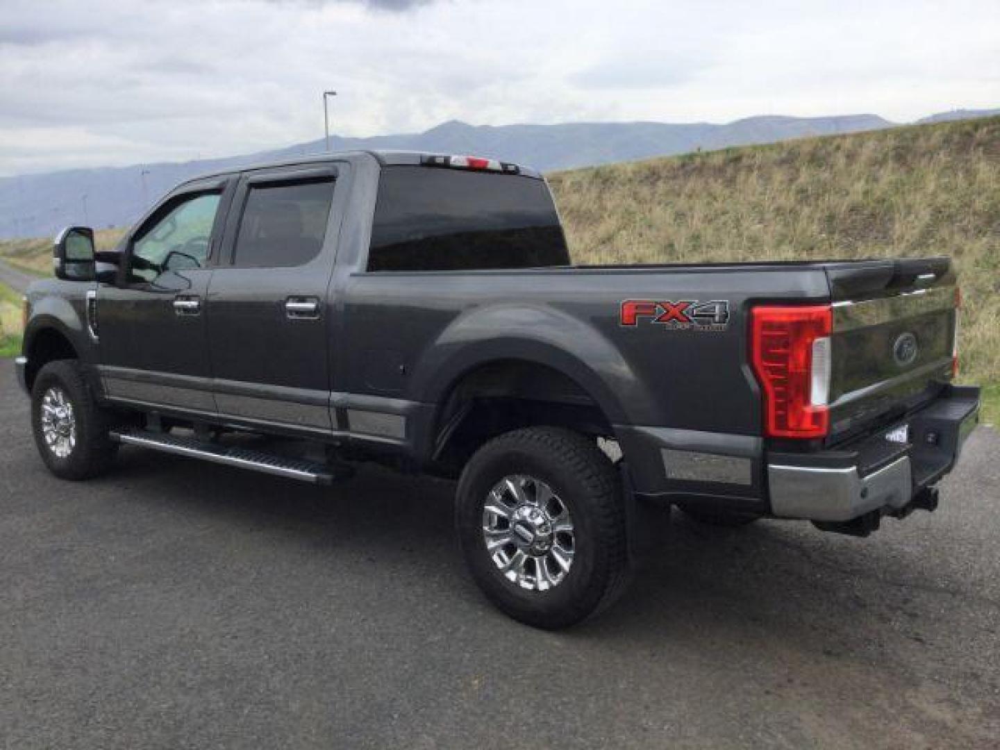 2017 Magnetic Metallic /GRAY CLOTH Ford F-250 SD XLT Crew Cab 4WD (1FT7W2B68HE) with an 6.2L V8 OHV 16V engine, 6-Speed Automatic transmission, located at 1801 Main Street, Lewiston, 83501, (208) 743-9371, 46.417065, -117.004799 - Photo#2