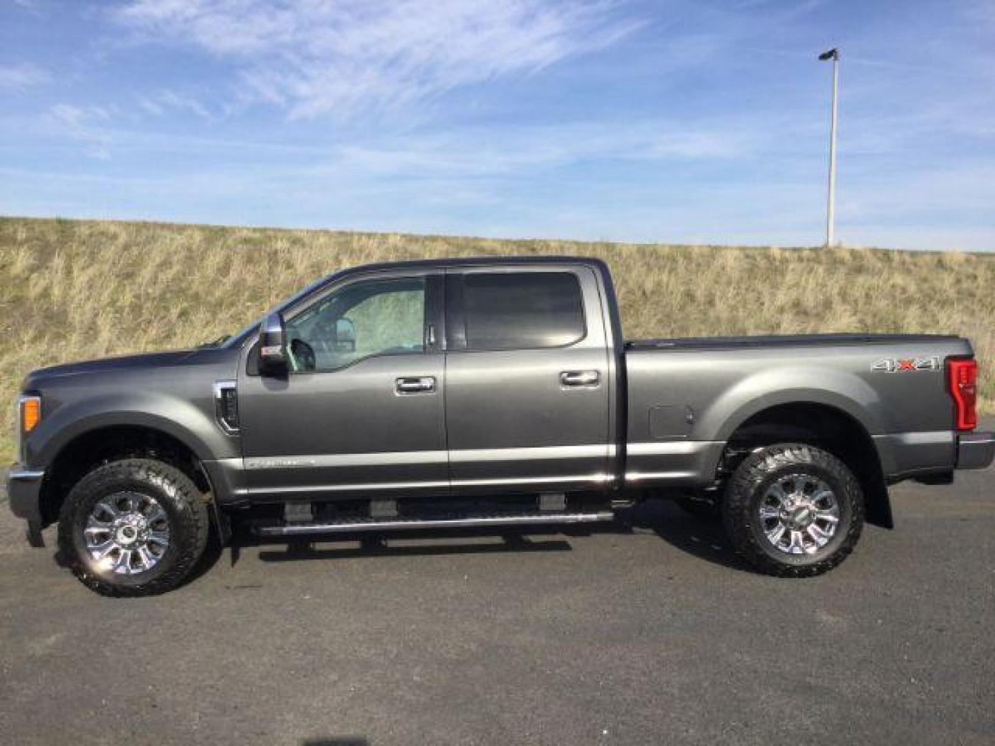 2017 Magnetic Metallic /BLACK LEATHER Ford F-250 SD Lariat Crew Cab 4WD (1FT7W2BT8HE) with an 6.7L V8 OHV 16V DIESEL engine, 6-Speed Automatic transmission, located at 1801 Main Street, Lewiston, 83501, (208) 743-9371, 46.417065, -117.004799 - Photo#1