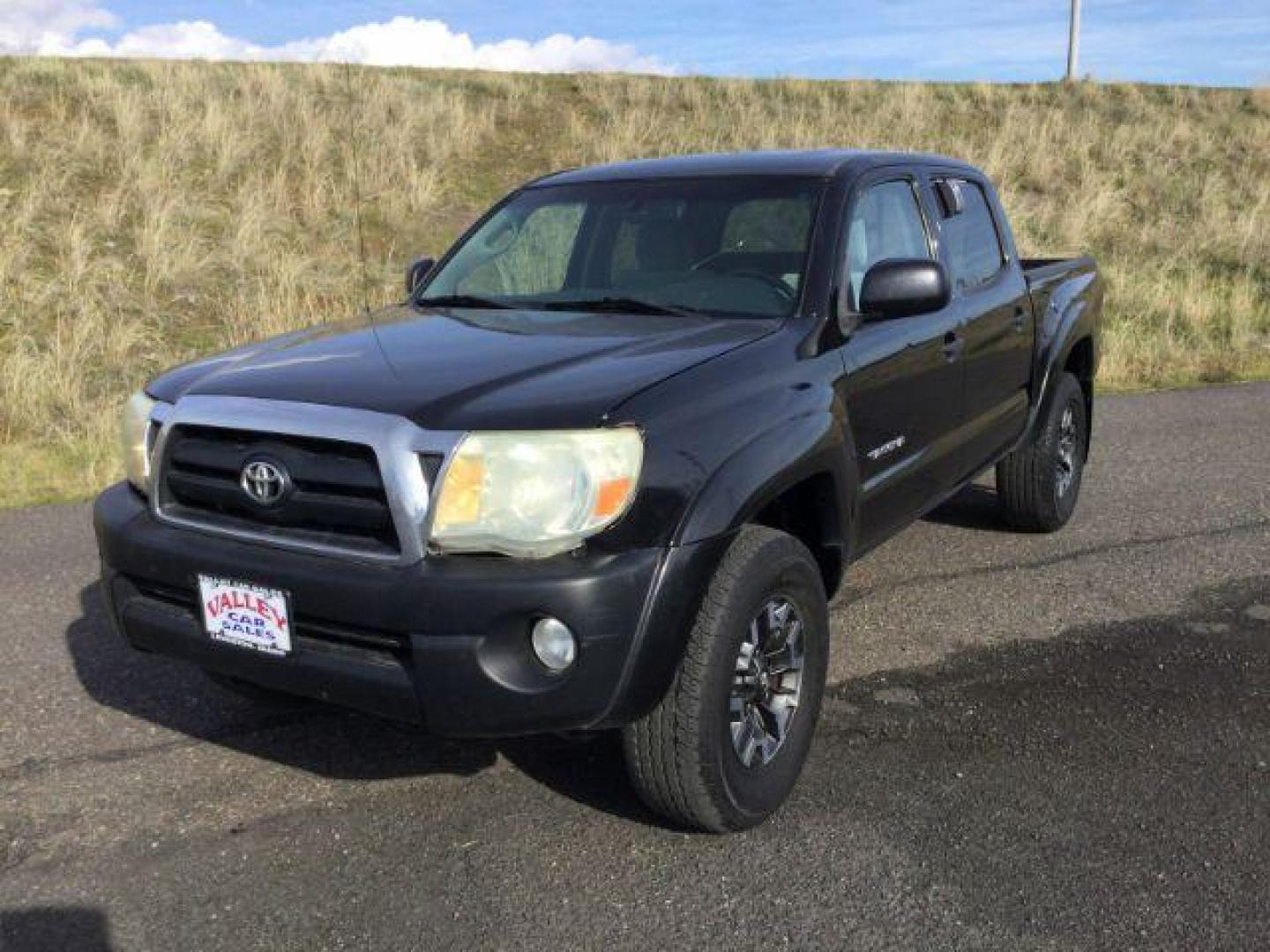 2006 Black Sand Pearl /Graphite Cloth Interior Toyota Tacoma Double Cab V6 4WD (5TELU42N06Z) with an 4.0L V6 DOHC 24V engine, 6-Speed Manual transmission, located at 1801 Main Street, Lewiston, 83501, (208) 743-9371, 46.417065, -117.004799 - Photo#0