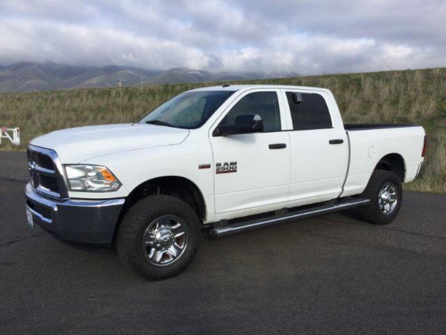 2017 Bright White Clear Coat /Black/Diesel Gray, cloth RAM 2500 Tradesman Crew Cab SWB 4WD (3C6UR5CJ3HG) with an 6.4L V8 engine, 6-Speed Automatic transmission, located at 1801 Main Street, Lewiston, 83501, (208) 743-9371, 46.417065, -117.004799 - Photo#0