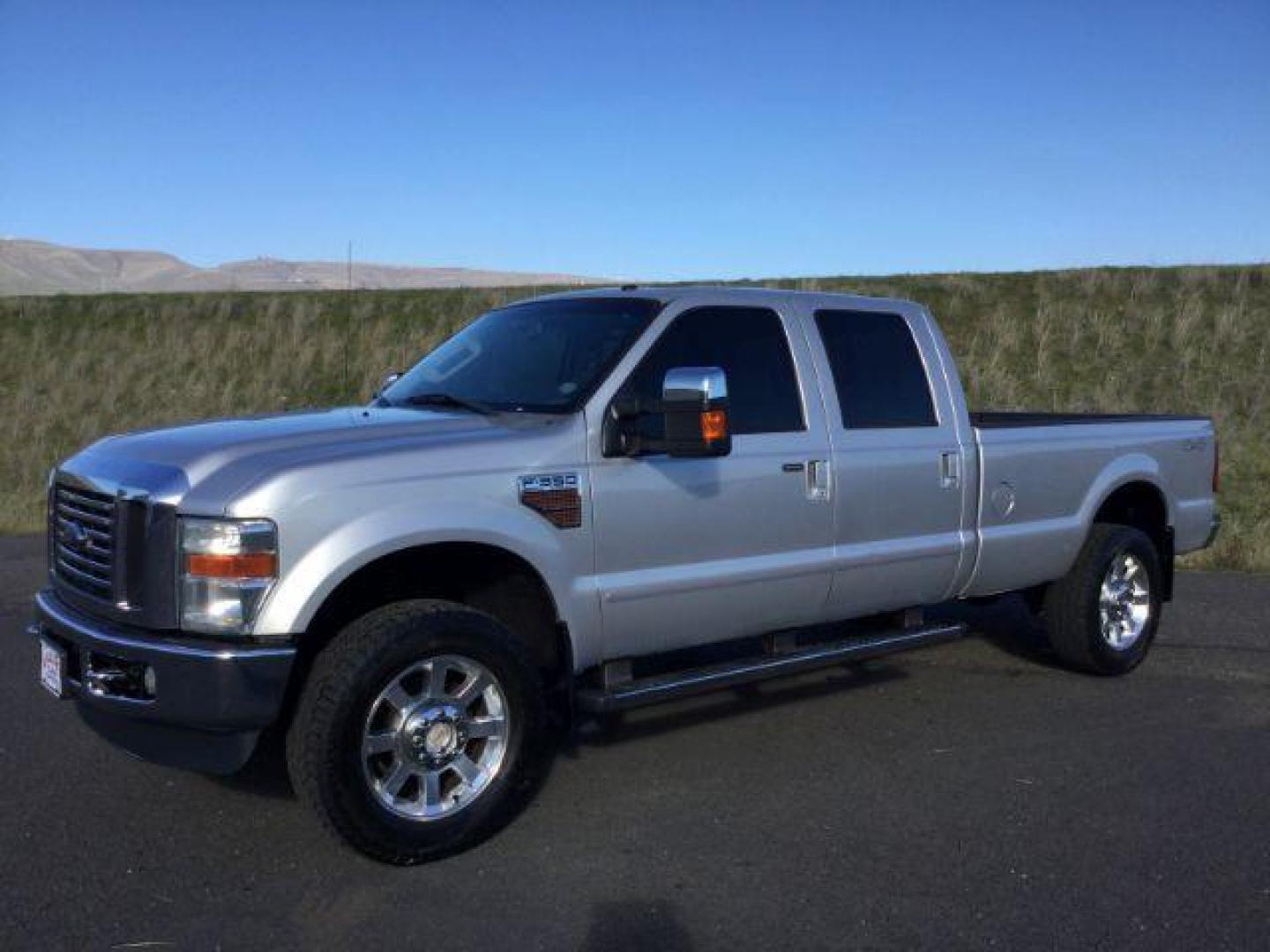 2010 Ingot Silver Metallic /Medium Stone Leather Interior Ford F-350 SD Lariat Crew Cab Long Bed 4WD (1FTWW3BR5AE) with an 6.4L V8 OHV 32V TURBO DIESEL engine, 5-Speed Automatic transmission, located at 1801 Main Street, Lewiston, 83501, (208) 743-9371, 46.417065, -117.004799 - Photo#0