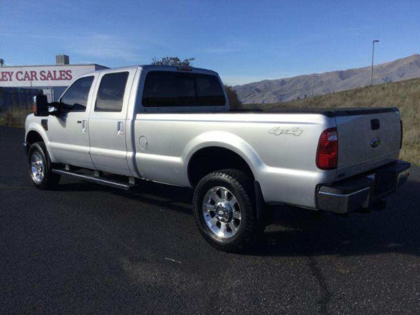 2010 Ingot Silver Metallic /Medium Stone Leather Interior Ford F-350 SD Lariat Crew Cab Long Bed 4WD (1FTWW3BR5AE) with an 6.4L V8 OHV 32V TURBO DIESEL engine, 5-Speed Automatic transmission, located at 1801 Main Street, Lewiston, 83501, (208) 743-9371, 46.417065, -117.004799 - Photo#2