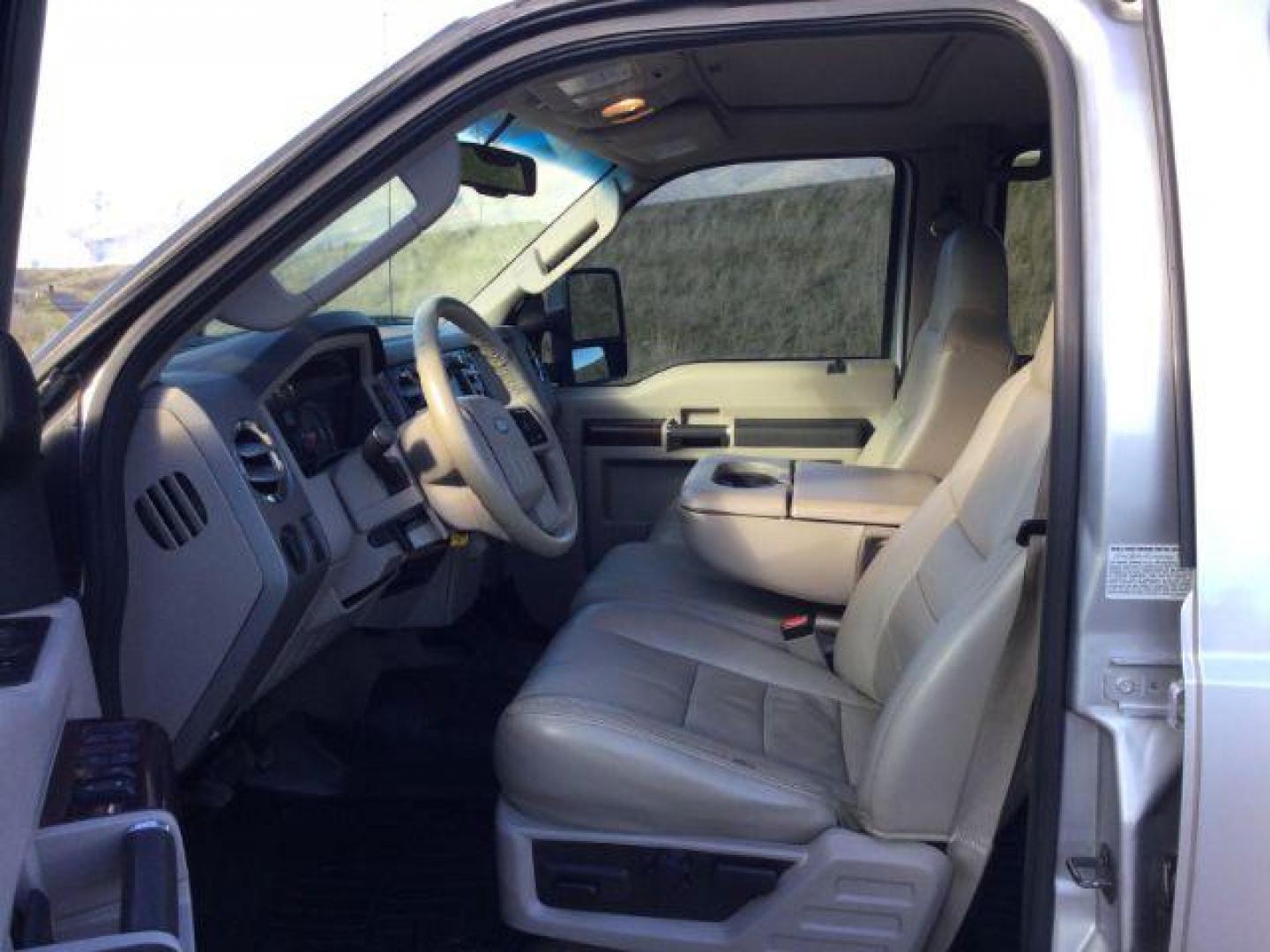 2010 Ingot Silver Metallic /Medium Stone Leather Interior Ford F-350 SD Lariat Crew Cab Long Bed 4WD (1FTWW3BR5AE) with an 6.4L V8 OHV 32V TURBO DIESEL engine, 5-Speed Automatic transmission, located at 1801 Main Street, Lewiston, 83501, (208) 743-9371, 46.417065, -117.004799 - Photo#3