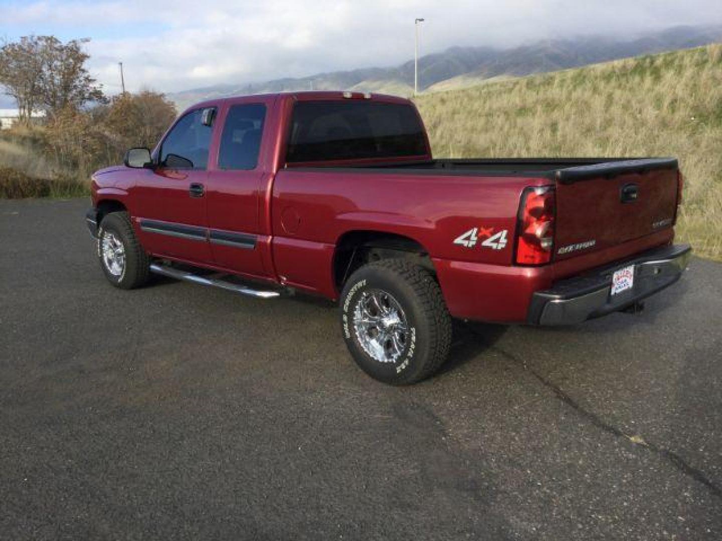 2005 Sport Red Metallic /Dark Charcoal Cloth Interior Chevrolet Silverado 1500 Ext. Cab Short Bed 4WD (2GCEK19VX51) with an 4.8L V8 OHV 16V engine, 4-Speed Automatic transmission, located at 1801 Main Street, Lewiston, 83501, (208) 743-9371, 46.417065, -117.004799 - Photo#1