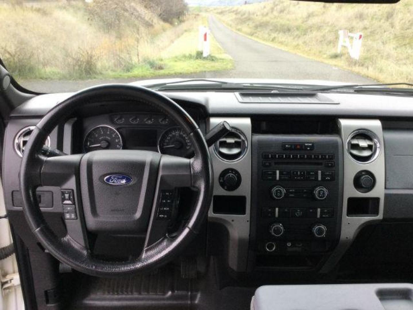 2012 Oxford White /Steel Gray Cloth Interior Ford F-150 XLT SuperCrew 6.5-ft. Bed 4WD (1FTFW1EF4CF) with an 5.0L V8 engine, 6-Speed Automatic transmission, located at 1801 Main Street, Lewiston, 83501, (208) 743-9371, 46.417065, -117.004799 - Photo#9