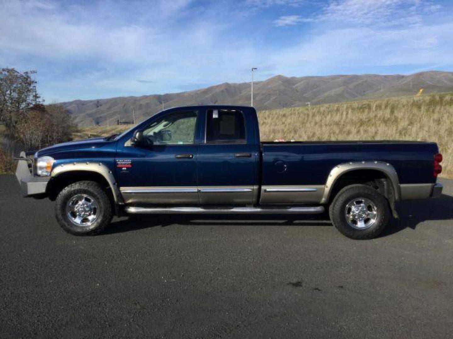 2008 Blue/Gold /Khaki Leather Dodge Ram 3500 Laramie Quad Cab 4WD (3D7MX38A68G) with an 6.7L L6 OHV 24V TURBO DIESEL engine, 6-Speed Manual Transmission transmission, located at 1801 Main Street, Lewiston, 83501, (208) 743-9371, 46.417065, -117.004799 - Photo#1