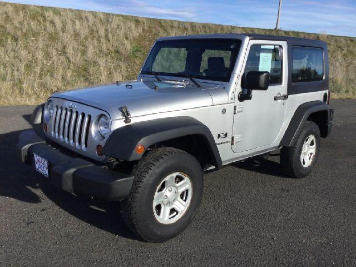 2008 Bright Silver Metallic with Black Hard Top /Dark Slate Gray/Medium Slate Gray Vinyl Interior Jeep Wrangler X (1J4FA24188L) with an 3.8L V6 OHV 12V engine, 6-Speed Manual transmission, located at 1801 Main Street, Lewiston, 83501, (208) 743-9371, 46.417065, -117.004799 - Photo#0