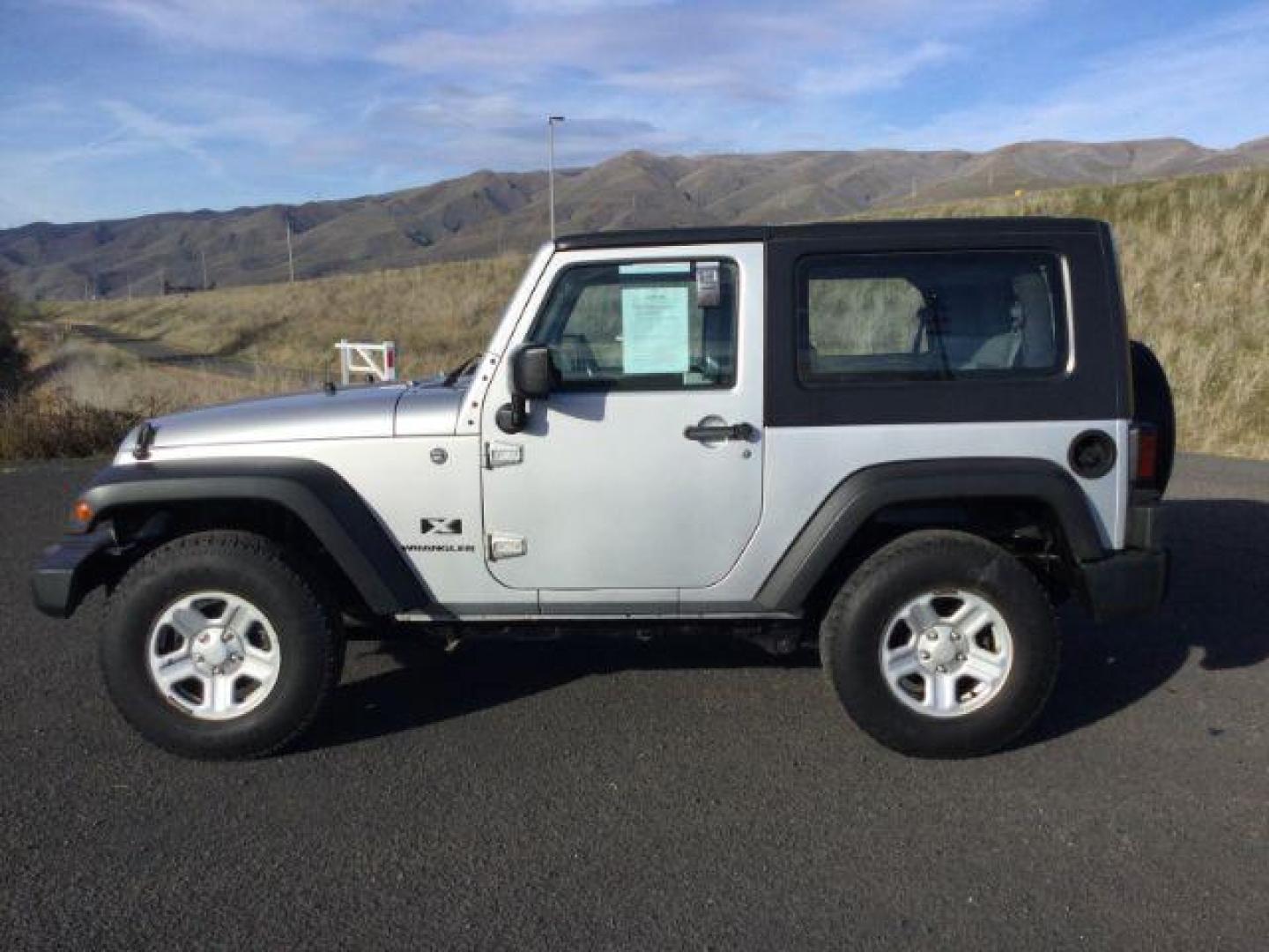 2008 Bright Silver Metallic with Black Hard Top /Dark Slate Gray/Medium Slate Gray Vinyl Interior Jeep Wrangler X (1J4FA24188L) with an 3.8L V6 OHV 12V engine, 6-Speed Manual transmission, located at 1801 Main Street, Lewiston, 83501, (208) 743-9371, 46.417065, -117.004799 - Photo#1