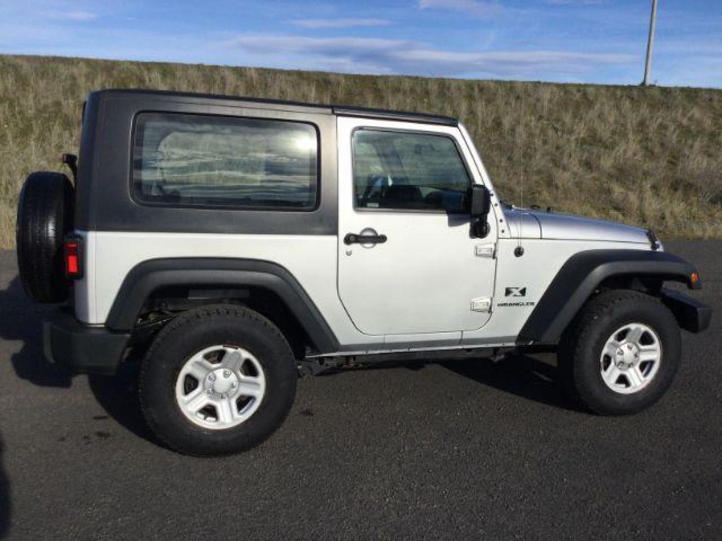 2008 Bright Silver Metallic with Black Hard Top /Dark Slate Gray/Medium Slate Gray Vinyl Interior Jeep Wrangler X (1J4FA24188L) with an 3.8L V6 OHV 12V engine, 6-Speed Manual transmission, located at 1801 Main Street, Lewiston, 83501, (208) 743-9371, 46.417065, -117.004799 - Photo#16