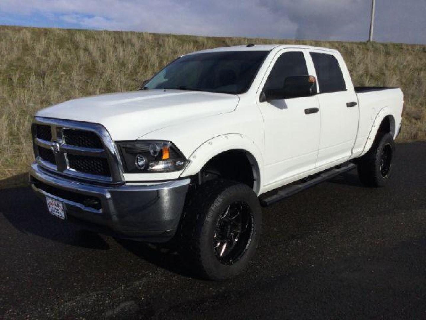 2016 Bright White Clear Coat /BLACK LEATHER RAM 2500 Tradesman Crew Cab SWB 4WD (3C6UR5CL7GG) with an 6.7L L6 OHV 24V TURBO DIESEL engine, 6-Speed Automatic transmission, located at 1801 Main Street, Lewiston, 83501, (208) 743-9371, 46.417065, -117.004799 - Photo#0