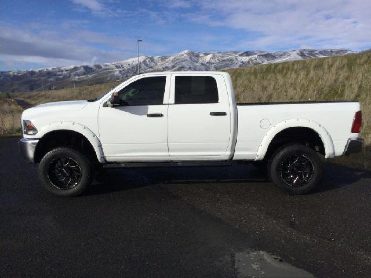 2016 Bright White Clear Coat /BLACK LEATHER RAM 2500 Tradesman Crew Cab SWB 4WD (3C6UR5CL7GG) with an 6.7L L6 OHV 24V TURBO DIESEL engine, 6-Speed Automatic transmission, located at 1801 Main Street, Lewiston, 83501, (208) 743-9371, 46.417065, -117.004799 - Photo#1