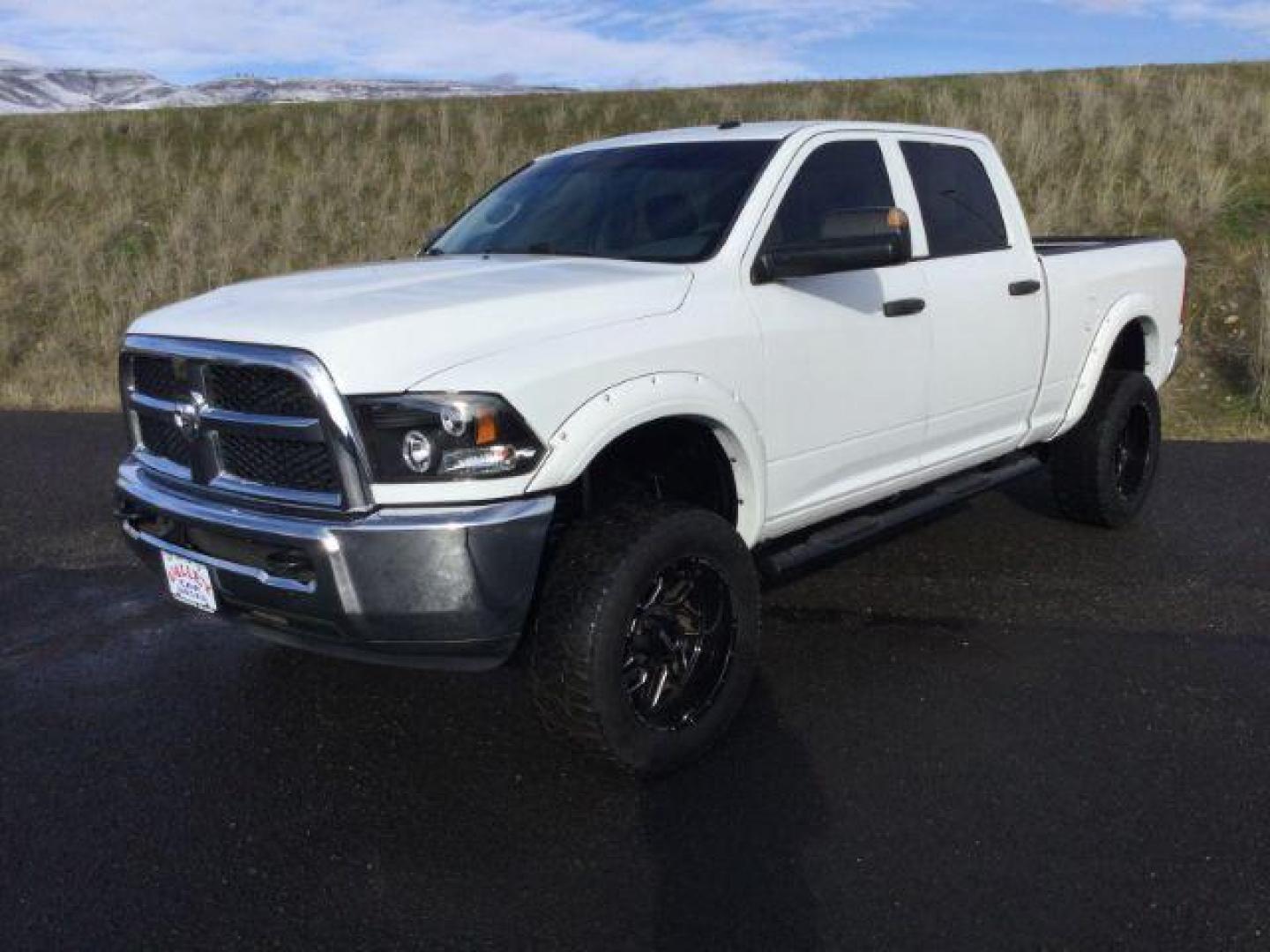 2016 Bright White Clear Coat /BLACK LEATHER RAM 2500 Tradesman Crew Cab SWB 4WD (3C6UR5CL7GG) with an 6.7L L6 OHV 24V TURBO DIESEL engine, 6-Speed Automatic transmission, located at 1801 Main Street, Lewiston, 83501, (208) 743-9371, 46.417065, -117.004799 - Photo#3