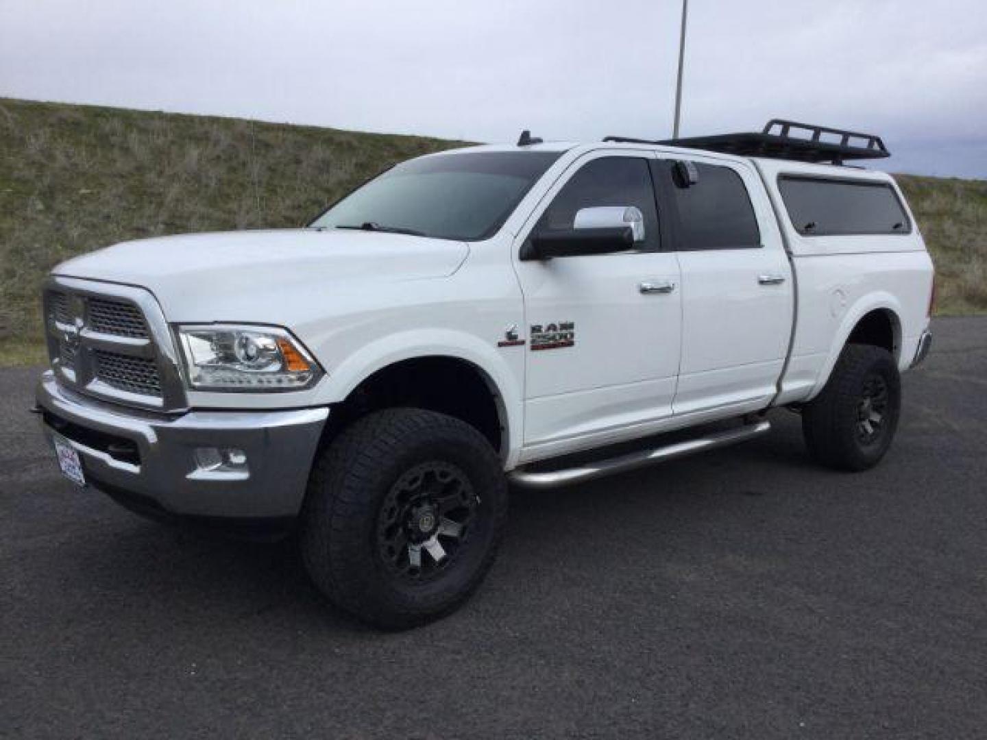 2015 Bright White Clear Coat /BLACK LEATHER RAM 2500 Laramie Crew Cab SWB 4WD (3C6UR5FL4FG) with an 6.7L L6 OHV 24V TURBO DIESEL engine, 6-Speed Automatic transmission, located at 1801 Main Street, Lewiston, 83501, (208) 743-9371, 46.417065, -117.004799 - Photo#0