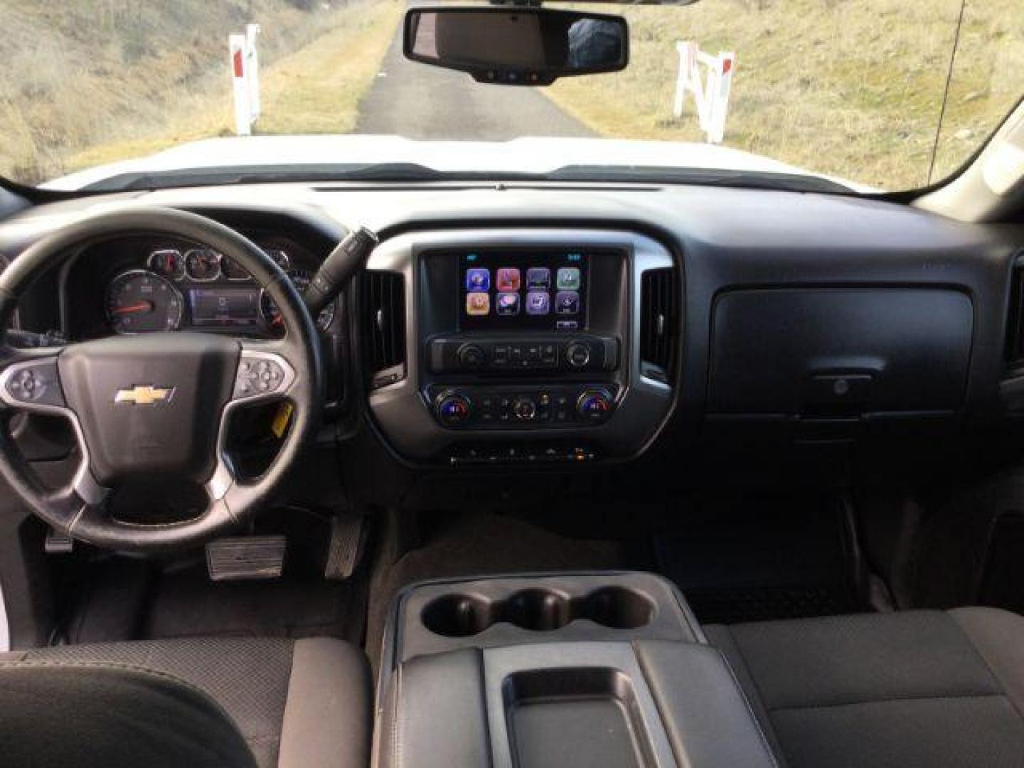 2017 Summit White /Jet Black, cloth Chevrolet Silverado 3500HD LT Crew Cab 4WD (1GC4KZCG9HF) with an 6.0L V8 OHV 16V FFV engine, 6-Speed Automatic transmission, located at 1801 Main Street, Lewiston, 83501, (208) 743-9371, 46.417065, -117.004799 - Photo#9