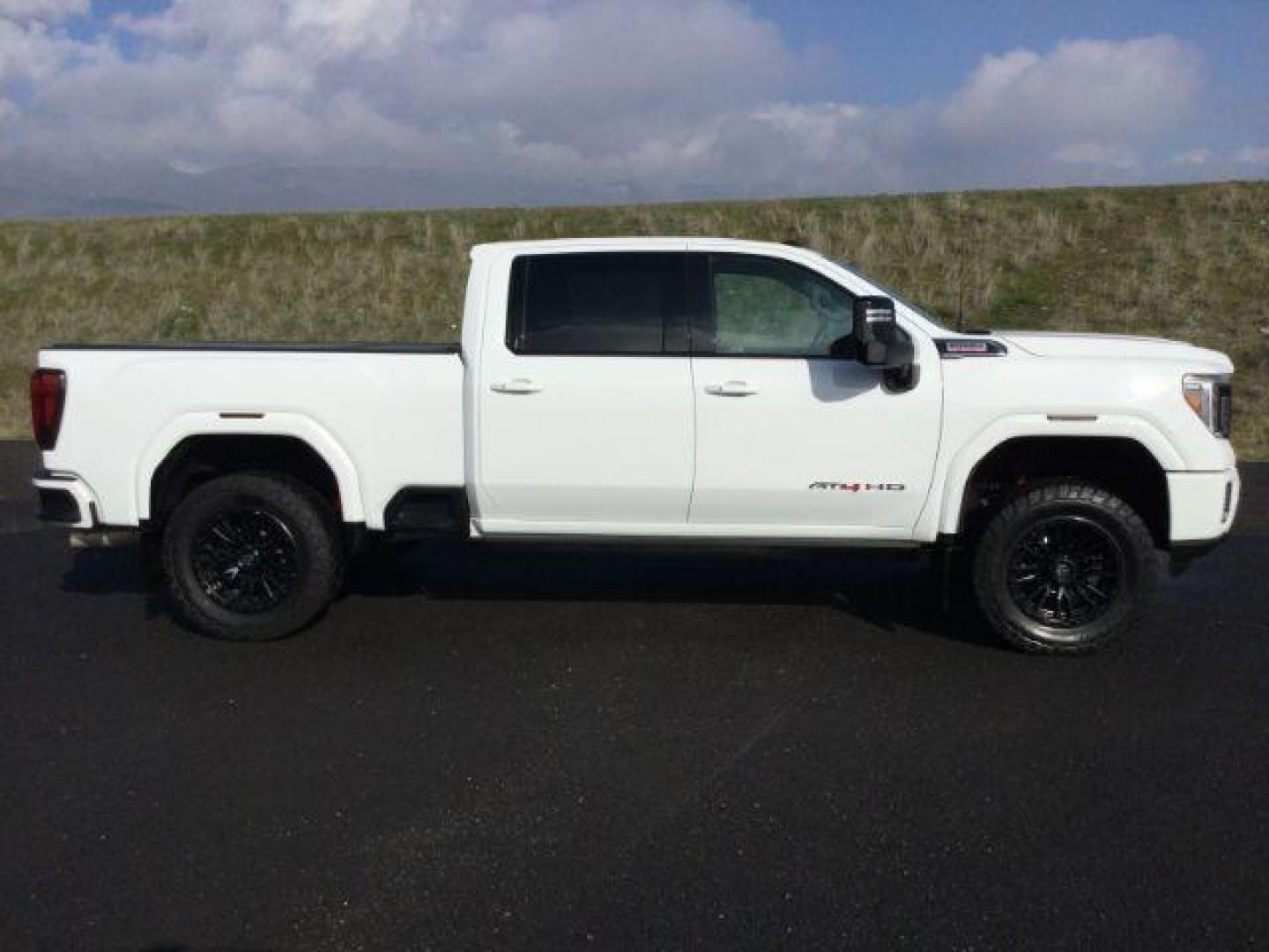 2021 Summit White /Jet Black w/Kalahari Accents GMC Sierra 3500HD AT4 Crew Cab 4WD (1GT49VEY8MF) with an 6.6L V8 OHV 16 DIESEL engine, 10-speed automatic transmission, located at 1801 Main Street, Lewiston, 83501, (208) 743-9371, 46.417065, -117.004799 - Photo#16