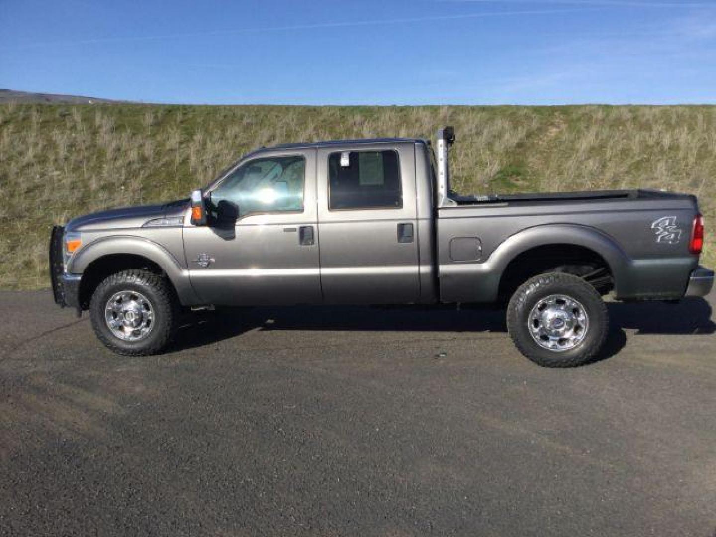 2014 Sterling Gray Metallic /Steel Ford F-350 SD XLT Crew Cab 4WD (1FT8W3BT3EE) with an 6.7L V8 OHV 16V DIESEL engine, 6-Speed Automatic transmission, located at 1801 Main Street, Lewiston, 83501, (208) 743-9371, 46.417065, -117.004799 - Photo#1