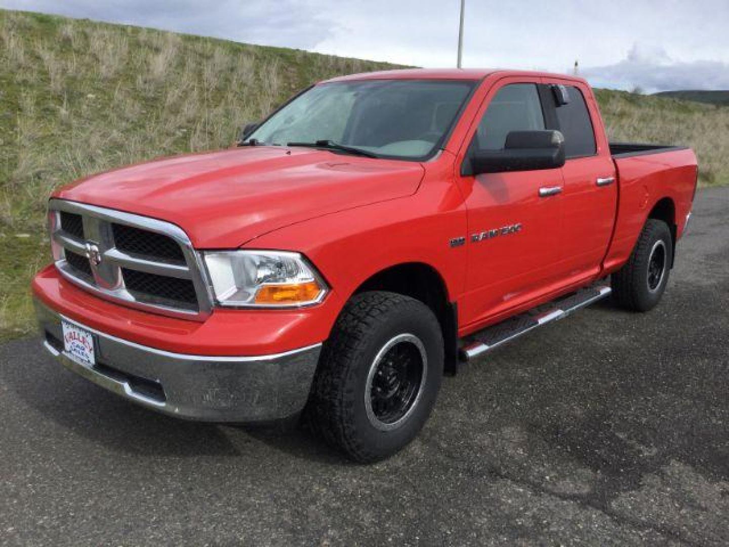 2011 Flame Red /Dark Slate/Medium Graystone Cloth Interior RAM 1500 SLT Quad Cab 4WD (1D7RV1GT9BS) with an 5.7L V8 OHV 16V engine, 5-Speed Automatic transmission, located at 1801 Main Street, Lewiston, 83501, (208) 743-9371, 46.417065, -117.004799 - Photo#0