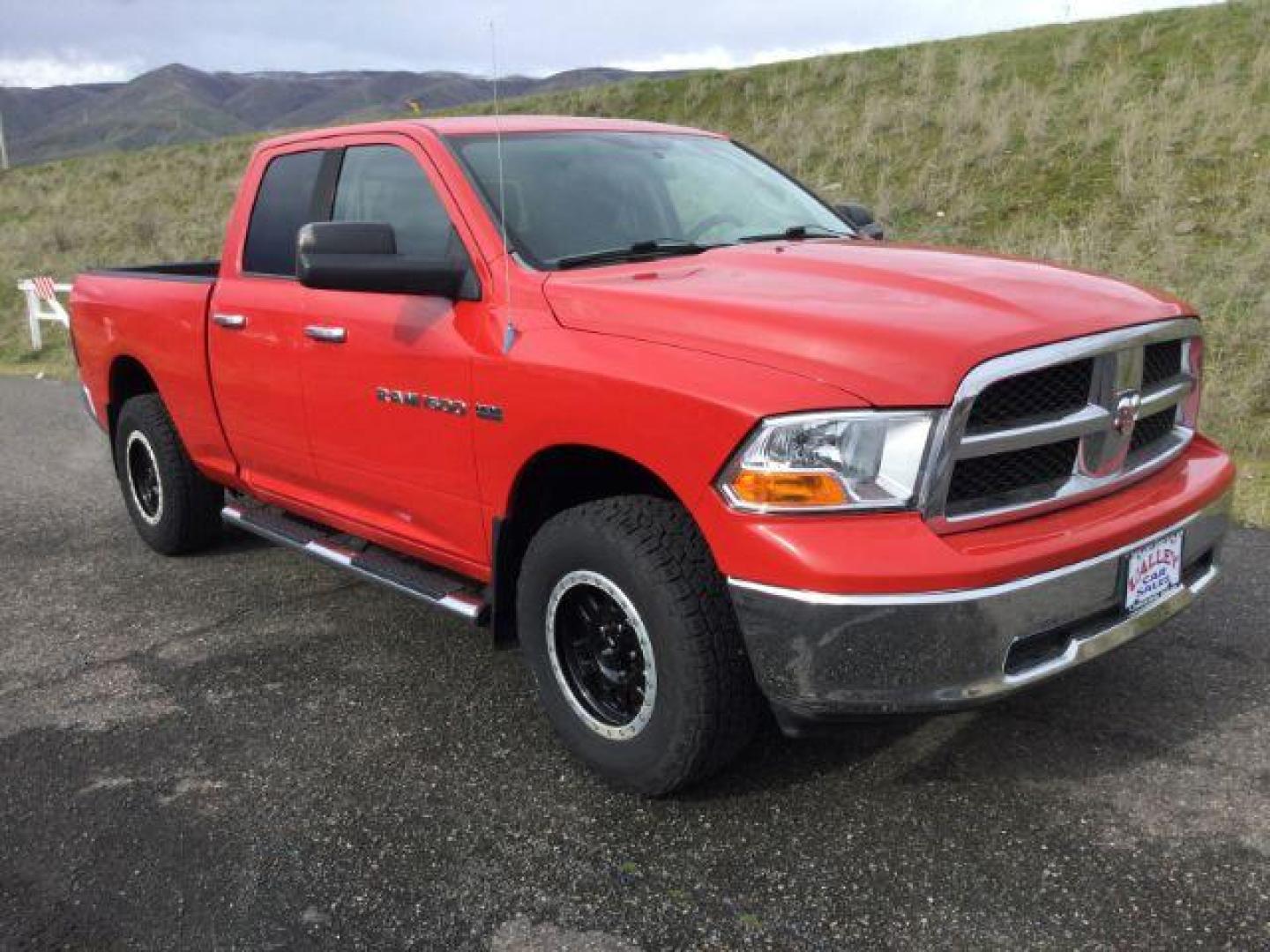 2011 Flame Red /Dark Slate/Medium Graystone Cloth Interior RAM 1500 SLT Quad Cab 4WD (1D7RV1GT9BS) with an 5.7L V8 OHV 16V engine, 5-Speed Automatic transmission, located at 1801 Main Street, Lewiston, 83501, (208) 743-9371, 46.417065, -117.004799 - Photo#16