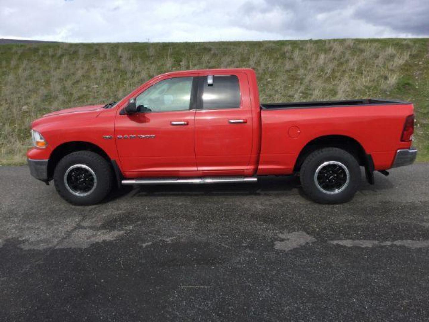 2011 Flame Red /Dark Slate/Medium Graystone Cloth Interior RAM 1500 SLT Quad Cab 4WD (1D7RV1GT9BS) with an 5.7L V8 OHV 16V engine, 5-Speed Automatic transmission, located at 1801 Main Street, Lewiston, 83501, (208) 743-9371, 46.417065, -117.004799 - Photo#1