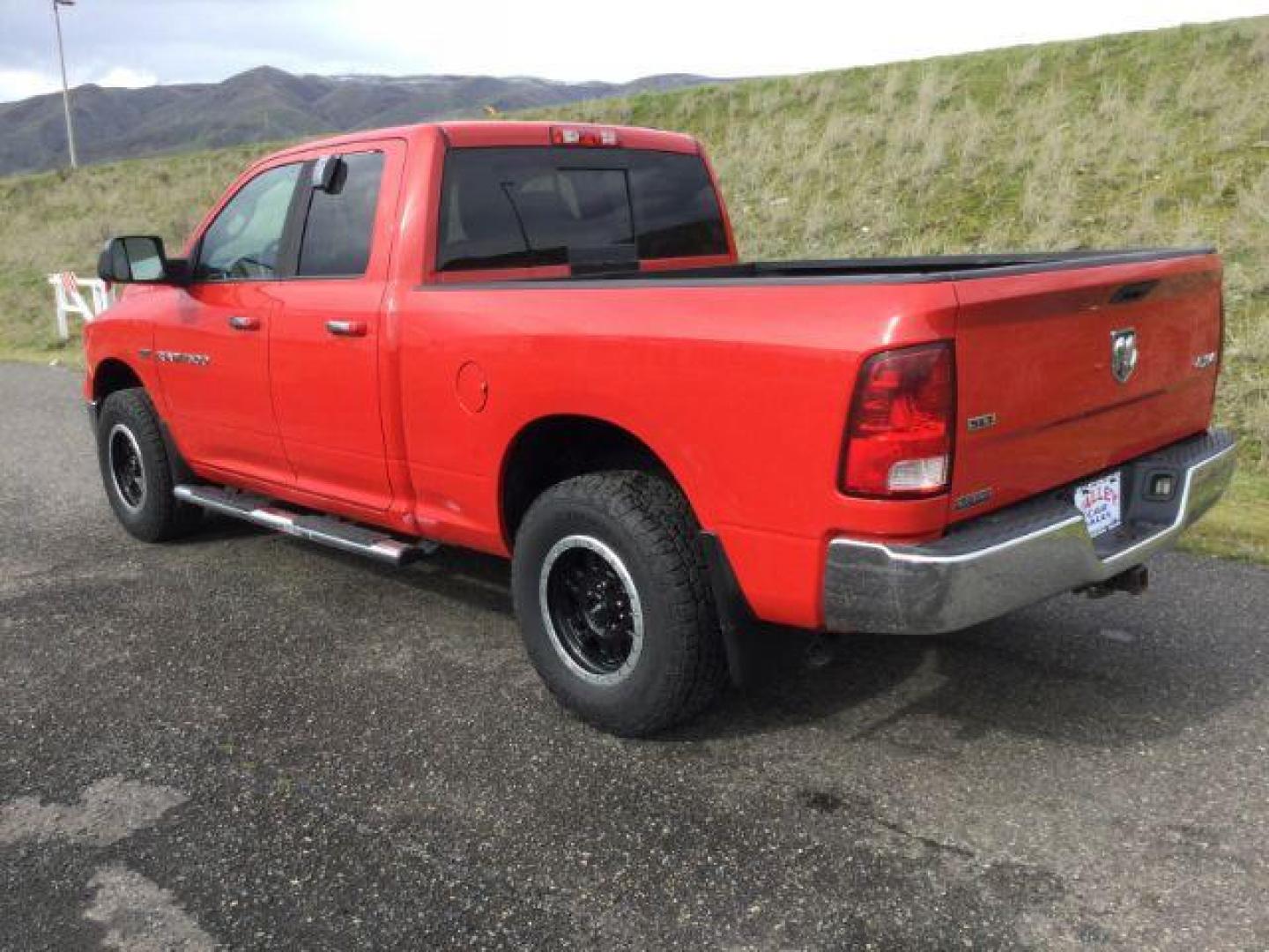 2011 Flame Red /Dark Slate/Medium Graystone Cloth Interior RAM 1500 SLT Quad Cab 4WD (1D7RV1GT9BS) with an 5.7L V8 OHV 16V engine, 5-Speed Automatic transmission, located at 1801 Main Street, Lewiston, 83501, (208) 743-9371, 46.417065, -117.004799 - Photo#2