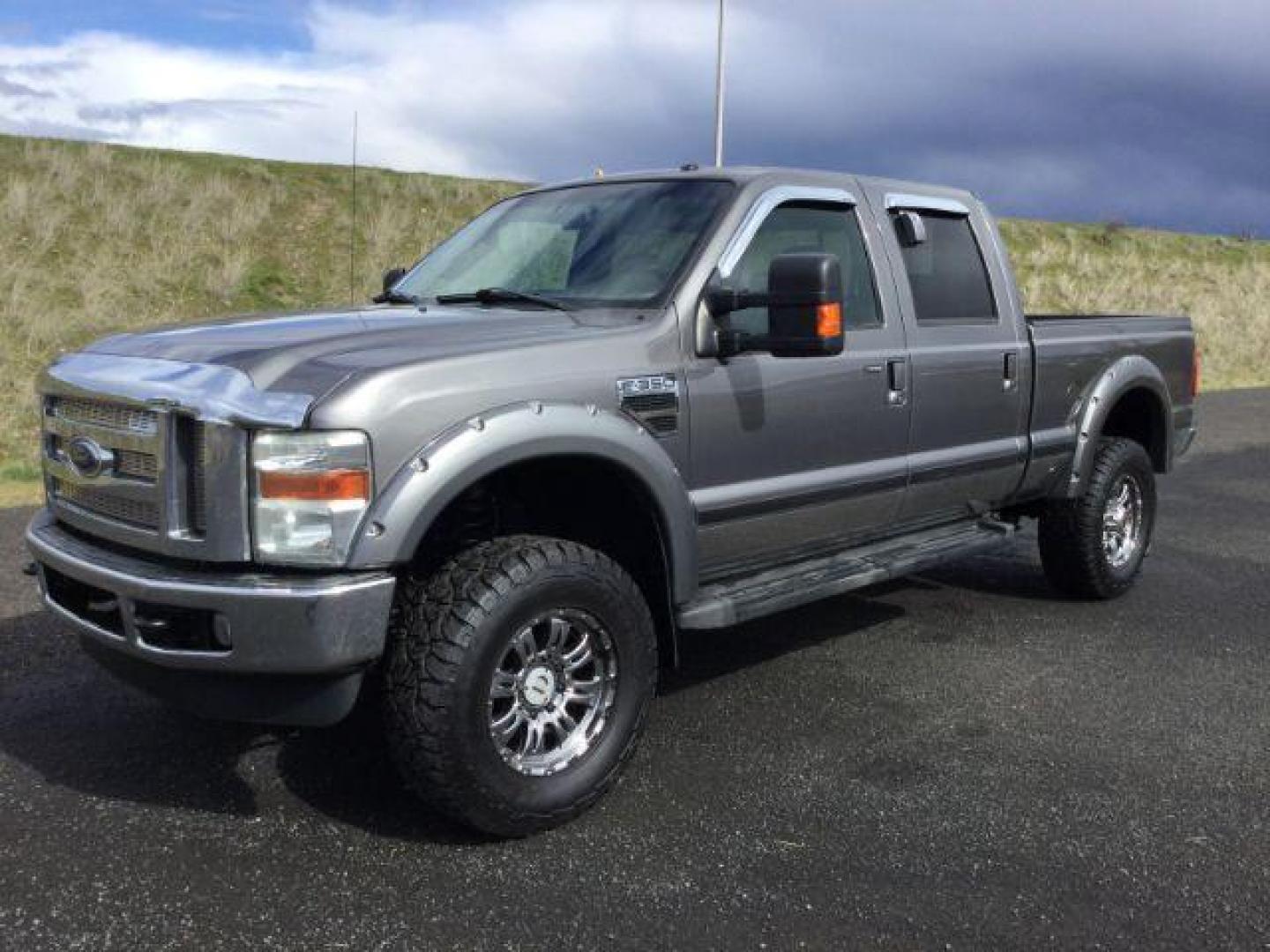 2010 Sterling Grey Metallic /Ebony Leather Interior Ford F-350 SD Lariat Crew Cab 4WD (1FTWW3BY5AE) with an 6.8L V10 SOHC 30V engine, 5-Speed Automatic transmission, located at 1801 Main Street, Lewiston, 83501, (208) 743-9371, 46.417065, -117.004799 - Photo#0