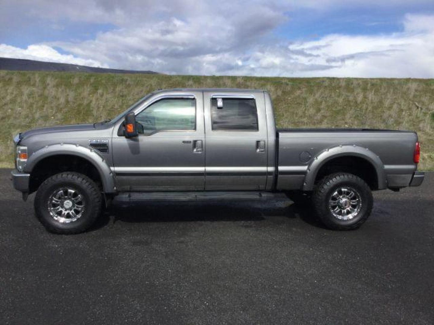 2010 Sterling Grey Metallic /Ebony Leather Interior Ford F-350 SD Lariat Crew Cab 4WD (1FTWW3BY5AE) with an 6.8L V10 SOHC 30V engine, 5-Speed Automatic transmission, located at 1801 Main Street, Lewiston, 83501, (208) 743-9371, 46.417065, -117.004799 - Photo#1