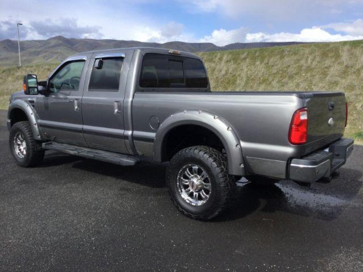 2010 Sterling Grey Metallic /Ebony Leather Interior Ford F-350 SD Lariat Crew Cab 4WD (1FTWW3BY5AE) with an 6.8L V10 SOHC 30V engine, 5-Speed Automatic transmission, located at 1801 Main Street, Lewiston, 83501, (208) 743-9371, 46.417065, -117.004799 - Photo#2