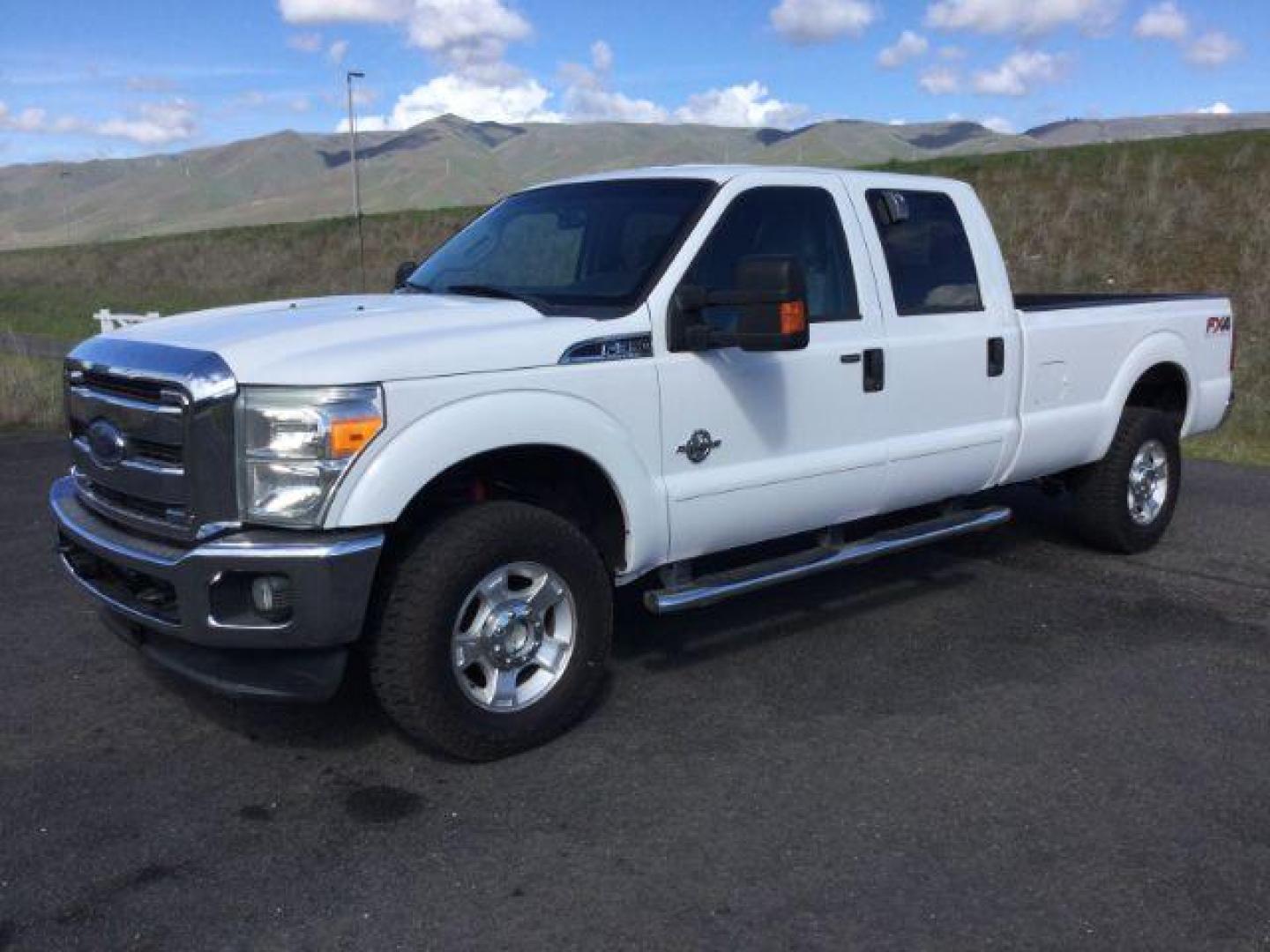 2013 Oxford White /Steel Cloth Interior Ford F-350 SD XLT Crew Cab Long Bed 4WD (1FT8W3BT1DE) with an 6.7L V8 OHV 16V DIESEL engine, 6-Speed Automatic transmission, located at 1801 Main Street, Lewiston, 83501, (208) 743-9371, 46.417065, -117.004799 - Photo#0