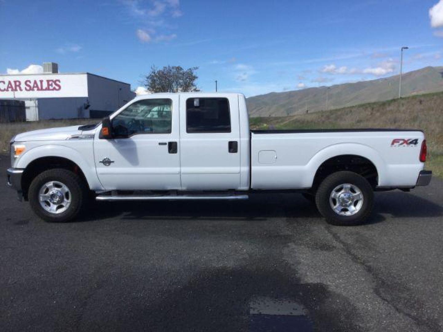 2013 Oxford White /Steel Cloth Interior Ford F-350 SD XLT Crew Cab Long Bed 4WD (1FT8W3BT1DE) with an 6.7L V8 OHV 16V DIESEL engine, 6-Speed Automatic transmission, located at 1801 Main Street, Lewiston, 83501, (208) 743-9371, 46.417065, -117.004799 - Photo#1