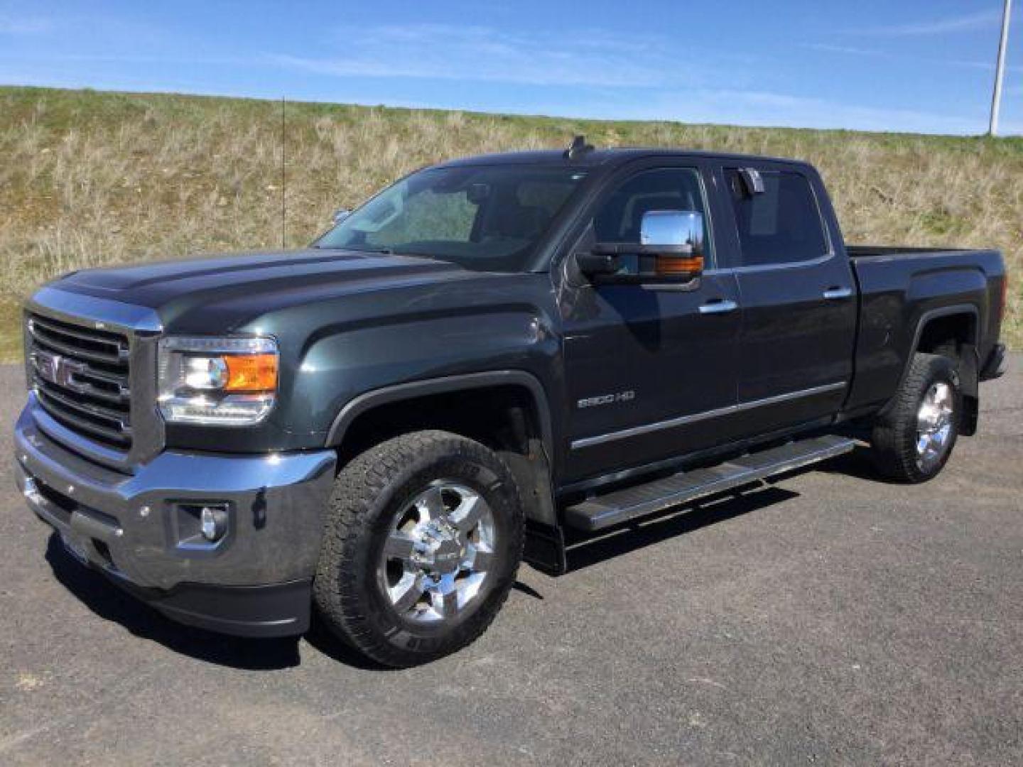 2017 Dark Slate Metallic /Jet Black, leather GMC Sierra 2500HD SLT Crew Cab 4WD (1GT12TEG6HF) with an 6.0L V8 OHV 16V FFV engine, 6-Speed Automatic transmission, located at 1801 Main Street, Lewiston, 83501, (208) 743-9371, 46.417065, -117.004799 - Photo#0