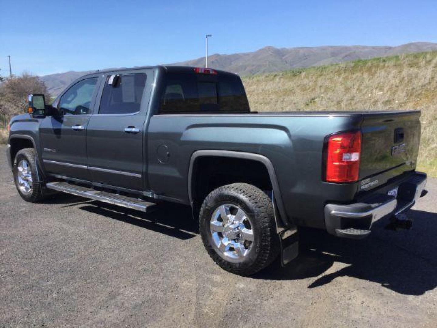 2017 Dark Slate Metallic /Jet Black, leather GMC Sierra 2500HD SLT Crew Cab 4WD (1GT12TEG6HF) with an 6.0L V8 OHV 16V FFV engine, 6-Speed Automatic transmission, located at 1801 Main Street, Lewiston, 83501, (208) 743-9371, 46.417065, -117.004799 - Photo#2