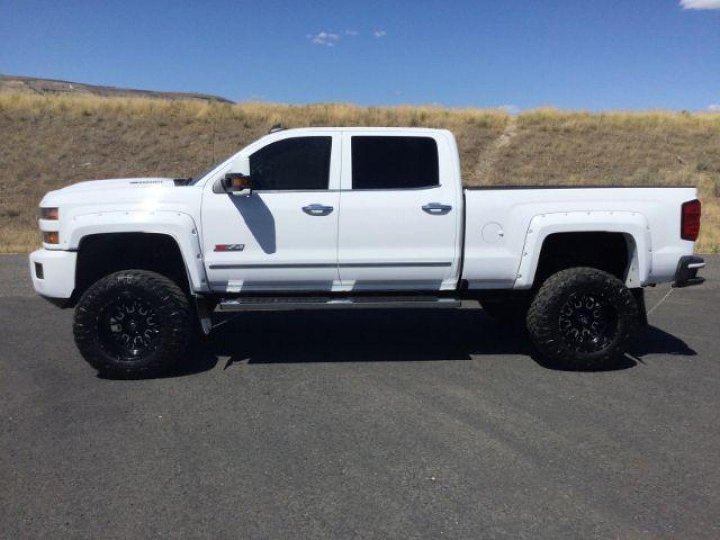 2019 Summit White /Jet Black, leather Chevrolet Silverado 2500HD LTZ Crew Cab Short Box 4WD (1GC1KTEYXKF) with an 6.6L V8 OHV 16V DIESEL engine, 6-Speed Automatic transmission, located at 1801 Main Street, Lewiston, 83501, (208) 743-9371, 46.417065, -117.004799 - Photo#1