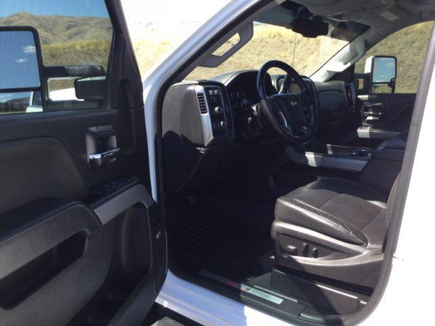 2019 Summit White /Jet Black, leather Chevrolet Silverado 2500HD LTZ Crew Cab Short Box 4WD (1GC1KTEYXKF) with an 6.6L V8 OHV 16V DIESEL engine, 6-Speed Automatic transmission, located at 1801 Main Street, Lewiston, 83501, (208) 743-9371, 46.417065, -117.004799 - Photo#3