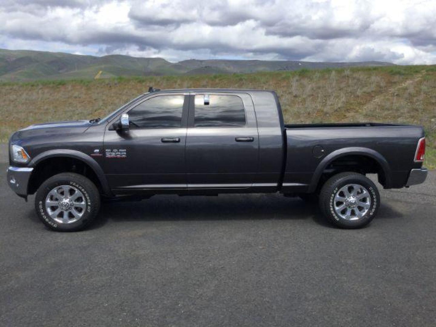 2017 Granite Crystal Metallic Clear Coat /Black, leather RAM 2500 Laramie Mega Cab 4WD (3C6UR5NL1HG) with an 6.7L L6 OHV 24V TURBO DIESEL engine, 6-Speed Automatic transmission, located at 1801 Main Street, Lewiston, 83501, (208) 743-9371, 46.417065, -117.004799 - Photo#1