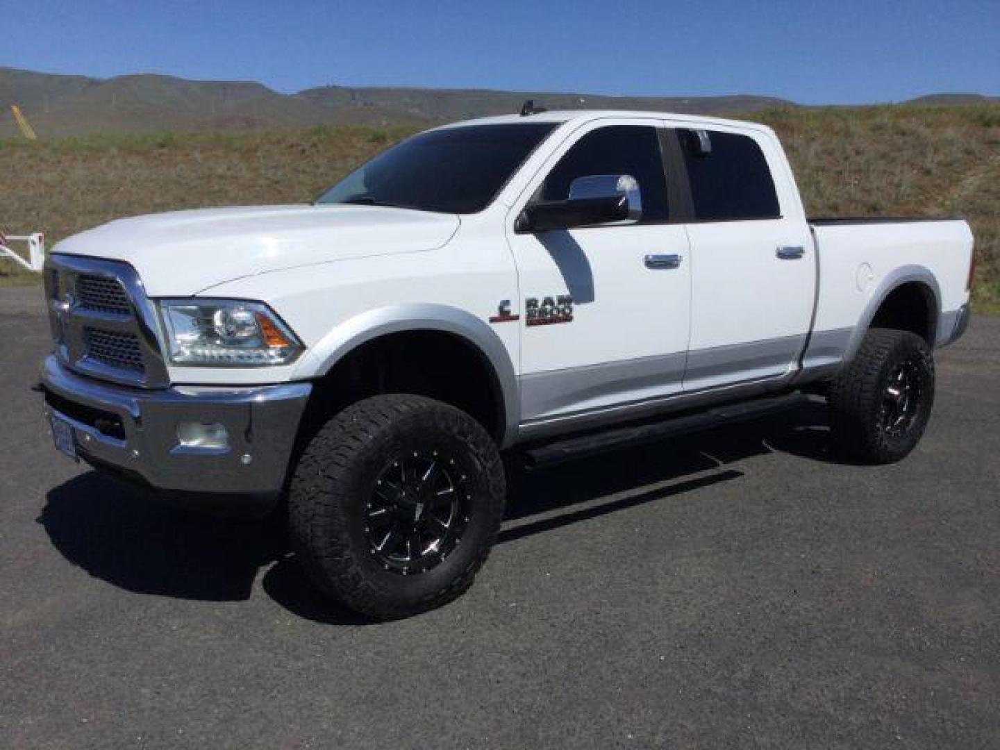 2016 Bright White Clear Coat/Bright Silver Metallic Cle /Black, leather RAM 2500 Laramie Crew Cab SWB 4WD (3C6UR5FL3GG) with an 6.7L L6 OHV 24V TURBO DIESEL engine, 6-Speed Automatic transmission, located at 1801 Main Street, Lewiston, 83501, (208) 743-9371, 46.417065, -117.004799 - Photo#0