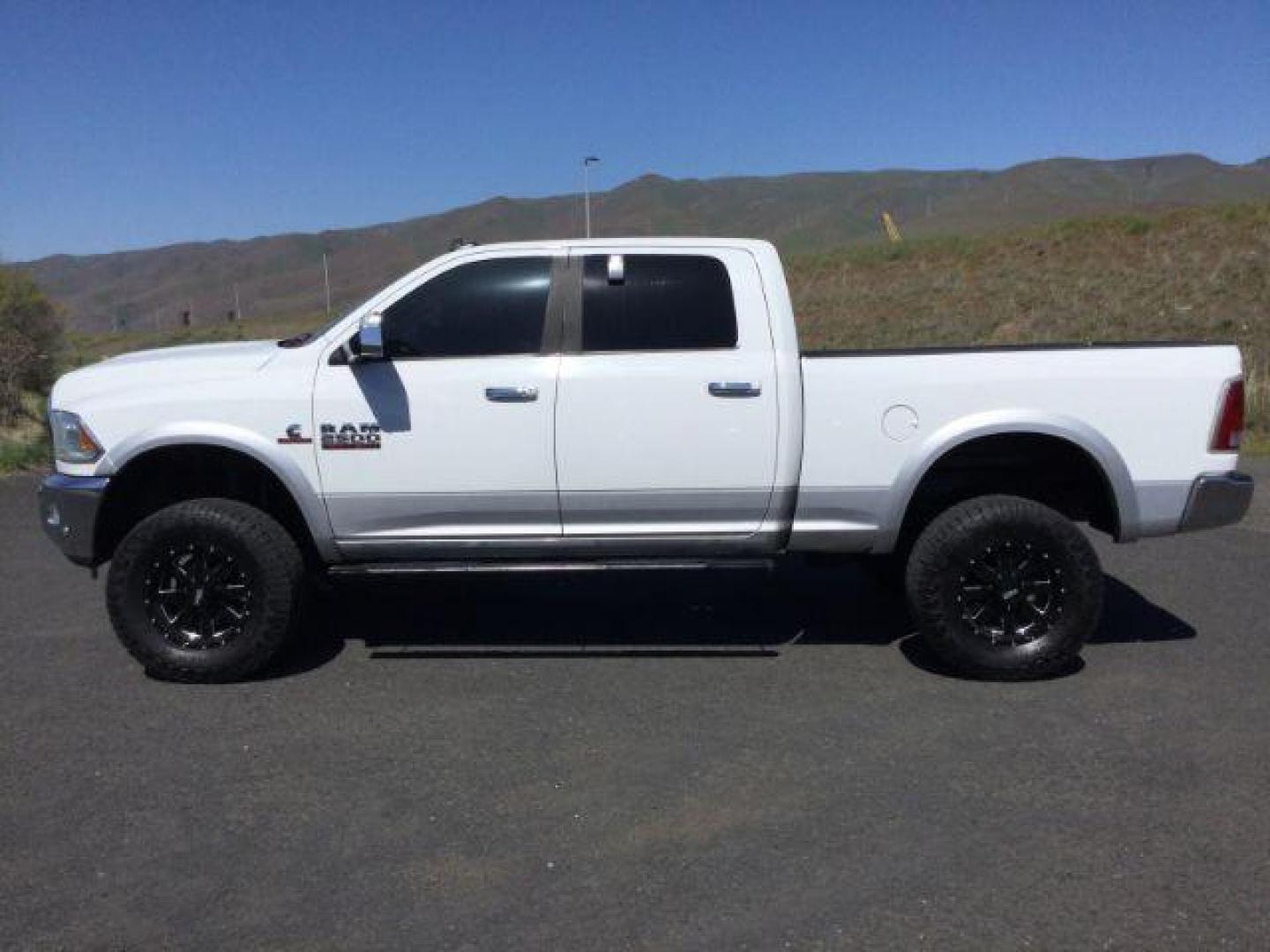 2016 Bright White Clear Coat/Bright Silver Metallic Cle /Black, leather RAM 2500 Laramie Crew Cab SWB 4WD (3C6UR5FL3GG) with an 6.7L L6 OHV 24V TURBO DIESEL engine, 6-Speed Automatic transmission, located at 1801 Main Street, Lewiston, 83501, (208) 743-9371, 46.417065, -117.004799 - Photo#1