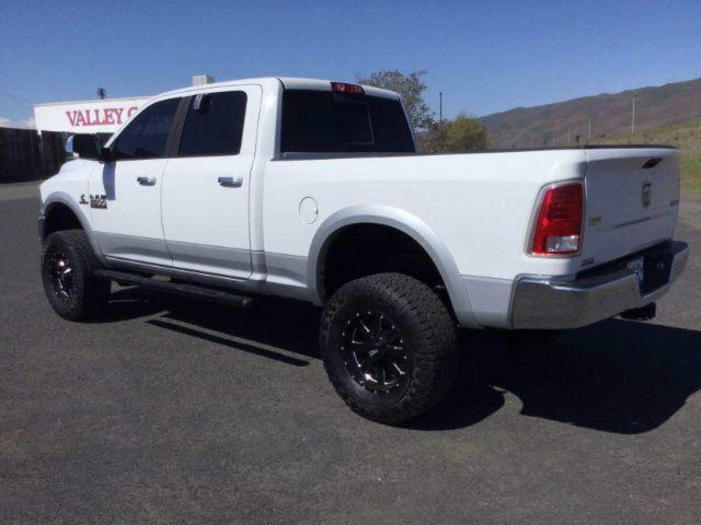 2016 Bright White Clear Coat/Bright Silver Metallic Cle /Black, leather RAM 2500 Laramie Crew Cab SWB 4WD (3C6UR5FL3GG) with an 6.7L L6 OHV 24V TURBO DIESEL engine, 6-Speed Automatic transmission, located at 1801 Main Street, Lewiston, 83501, (208) 743-9371, 46.417065, -117.004799 - Photo#2