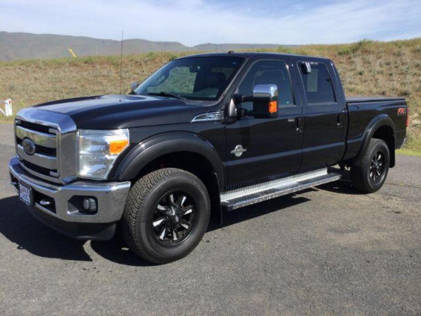 2012 Black /Black Leather Interior Ford F-350 SD Lariat Crew Cab 4WD (1FT8W3BT6CE) with an 6.7L V8 OHV 16V DIESEL engine, 6-Speed Automatic transmission, located at 1801 Main Street, Lewiston, 83501, (208) 743-9371, 46.417065, -117.004799 - Photo#0