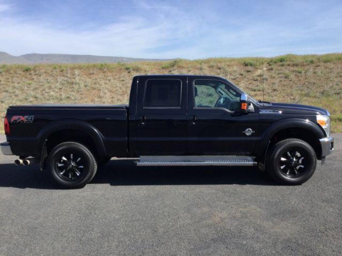 2012 Black /Black Leather Interior Ford F-350 SD Lariat Crew Cab 4WD (1FT8W3BT6CE) with an 6.7L V8 OHV 16V DIESEL engine, 6-Speed Automatic transmission, located at 1801 Main Street, Lewiston, 83501, (208) 743-9371, 46.417065, -117.004799 - Photo#9