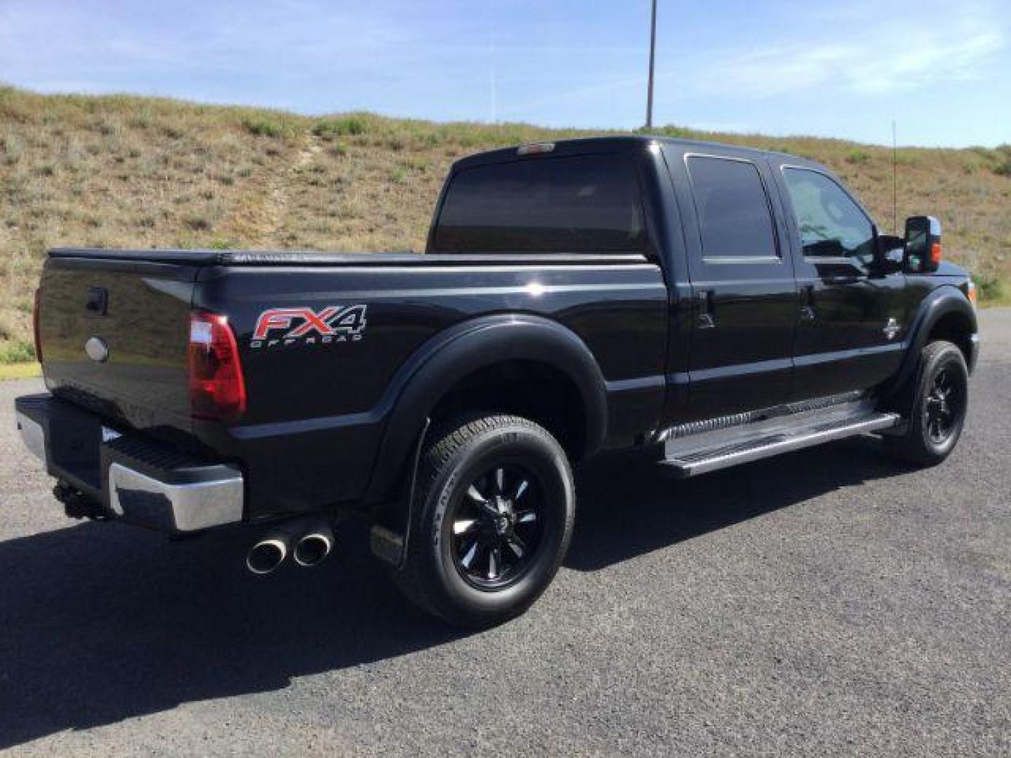 2012 Black /Black Leather Interior Ford F-350 SD Lariat Crew Cab 4WD (1FT8W3BT6CE) with an 6.7L V8 OHV 16V DIESEL engine, 6-Speed Automatic transmission, located at 1801 Main Street, Lewiston, 83501, (208) 743-9371, 46.417065, -117.004799 - Photo#10