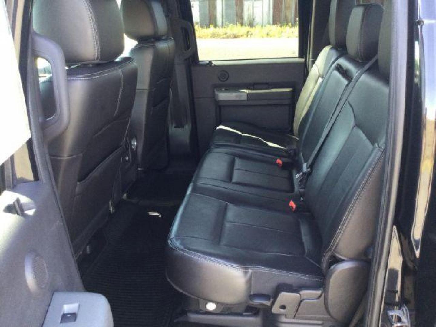 2012 Black /Black Leather Interior Ford F-350 SD Lariat Crew Cab 4WD (1FT8W3BT6CE) with an 6.7L V8 OHV 16V DIESEL engine, 6-Speed Automatic transmission, located at 1801 Main Street, Lewiston, 83501, (208) 743-9371, 46.417065, -117.004799 - Photo#4